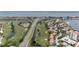 Aerial view of community near golf course and road at 6268 Palma Del Mar S Blvd # 407, St Petersburg, FL 33715