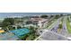 Aerial view shows community, tennis courts, and marina at 6268 Palma Del Mar S Blvd # 407, St Petersburg, FL 33715