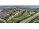 Aerial view of community, golf course, and waterway at 6268 Palma Del Mar S Blvd # 407, St Petersburg, FL 33715