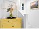 Stylish entryway featuring a yellow cabinet and staircase at 155 5Th N Ave, St Petersburg, FL 33701