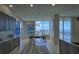 Kitchen with ocean view and dark wood cabinets at 1560 Gulf Blvd # 1107, Clearwater Beach, FL 33767