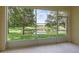 Relaxing screened porch overlooking a pond at 485 Harbor Ridge Dr, Palm Harbor, FL 34683