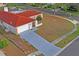 Aerial view of the house, showing the roofline and landscaping at 2502 Indigo Dr, Dunedin, FL 34698