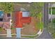 Single-story home on corner lot, showing driveway at 2502 Indigo Dr, Dunedin, FL 34698