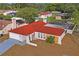 Single story home with red tile roof and large backyard at 2502 Indigo Dr, Dunedin, FL 34698