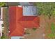 Top-down aerial view of the house and its red tile roof at 2502 Indigo Dr, Dunedin, FL 34698