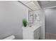 Bathroom with white vanity and a large mirror at 2502 Indigo Dr, Dunedin, FL 34698