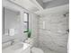 Modern bathroom with marble shower and updated fixtures at 2502 Indigo Dr, Dunedin, FL 34698