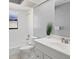 Bathroom with white vanity and shower/tub combo at 2502 Indigo Dr, Dunedin, FL 34698