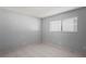 Simple bedroom with tile floors and window coverings at 2502 Indigo Dr, Dunedin, FL 34698