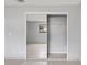 Mirrored closet with open shelving and window at 2502 Indigo Dr, Dunedin, FL 34698