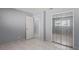 Bedroom with mirrored closet doors and tile floors at 2502 Indigo Dr, Dunedin, FL 34698