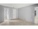 Light and airy bedroom with tile floors and ensuite bathroom at 2502 Indigo Dr, Dunedin, FL 34698