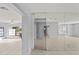Bright entryway with tile floors and mirrored wall at 2502 Indigo Dr, Dunedin, FL 34698