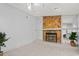 Stone fireplace with tiled hearth in living room at 2502 Indigo Dr, Dunedin, FL 34698