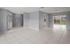 Open living area with tile floor and view of backyard at 2502 Indigo Dr, Dunedin, FL 34698