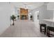 Living room features a stone fireplace and tiled floors at 2502 Indigo Dr, Dunedin, FL 34698