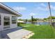 Back patio with canal view and walkway at 4145 Star Island Dr, Holiday, FL 34691