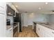 Modern kitchen with granite countertops and stainless steel appliances at 4145 Star Island Dr, Holiday, FL 34691