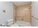 Bathroom with beige tile shower/tub and grab bars at 4145 Star Island Dr, Holiday, FL 34691