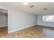 Spacious living room with tile floors and access to hallway at 4145 Star Island Dr, Holiday, FL 34691
