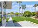 Spacious backyard with patio, overlooking a tranquil canal at 4145 Star Island Dr, Holiday, FL 34691
