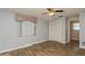 Bedroom with tile floors, window, ceiling fan and closet at 4145 Star Island Dr, Holiday, FL 34691