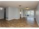 Living area with tile floors and access to kitchen and patio at 4145 Star Island Dr, Holiday, FL 34691