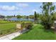 Backyard with raised garden bed and canal view at 4145 Star Island Dr, Holiday, FL 34691