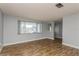 Living room with tile floors, large window and entryway view at 4145 Star Island Dr, Holiday, FL 34691