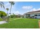 Large backyard with canal and neighbor views at 4145 Star Island Dr, Holiday, FL 34691