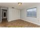 Bedroom with wood-look floors, light walls and double door closet at 4145 Star Island Dr, Holiday, FL 34691