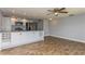Modern kitchen with white cabinets, granite countertops, and stainless steel appliances at 4145 Star Island Dr, Holiday, FL 34691