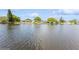 Tranquil waterfront view of several houses on a canal at 4145 Star Island Dr, Holiday, FL 34691