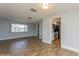 Open living room and kitchen with tile floors and view to backyard at 4145 Star Island Dr, Holiday, FL 34691
