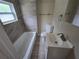 Updated bathroom with new bathtub, toilet and vanity at 1158 Palmetto St, Clearwater, FL 33755