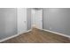 Bedroom with wood-look floors and access to another room at 3085 20Th S Ave, St Petersburg, FL 33712