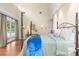 Spacious main bedroom with a large bed and access to backyard at 2901 Leprechaun Ln, Palm Harbor, FL 34683