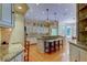 Spacious kitchen with large island, stainless steel appliances, and hardwood floors at 2901 Leprechaun Ln, Palm Harbor, FL 34683