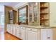 Kitchen features granite countertops, custom cabinetry, and a large picture at 2901 Leprechaun Ln, Palm Harbor, FL 34683