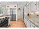 Modern kitchen with stainless steel appliances and granite countertops at 2901 Leprechaun Ln, Palm Harbor, FL 34683