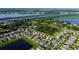 Expansive aerial view of homes near lush green spaces and tranquil blue waters at 105 Cascade Bend Dr, Ruskin, FL 33570