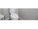 Clean, minimalist half-bathroom with a standard toilet and neutral wall color at 105 Cascade Bend Dr, Ruskin, FL 33570