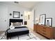 Well-lit bedroom with neutral colors and a modern interior, featuring decor and furnishings at 105 Cascade Bend Dr, Ruskin, FL 33570