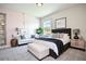 Stylish bedroom featuring a modern decor and design, with natural lighting, a bed, and ample furnishings at 105 Cascade Bend Dr, Ruskin, FL 33570
