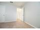 Cozy bedroom showcasing ample closet space, neutral walls, and soft carpeting at 105 Cascade Bend Dr, Ruskin, FL 33570