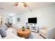 Open-concept living room leading to a dining area, featuring comfortable seating and modern decor at 105 Cascade Bend Dr, Ruskin, FL 33570