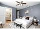 Spacious main bedroom offering a walk-in closet and a bench at the foot of the bed at 105 Cascade Bend Dr, Ruskin, FL 33570