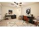 Spacious office featuring two work desks, a ceiling fan, and ample natural light at 105 Cascade Bend Dr, Ruskin, FL 33570