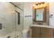 Modern bathroom featuring marble tile and a glass-enclosed shower at 2121 Bayou Grande Ne Blvd, St Petersburg, FL 33703